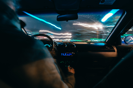 Riding through the city by car. view from the passenger compartmentの写真素材