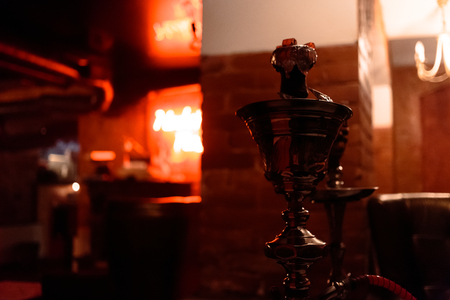 Ready hookah in the bar on a colorful background. Awesome photo.
