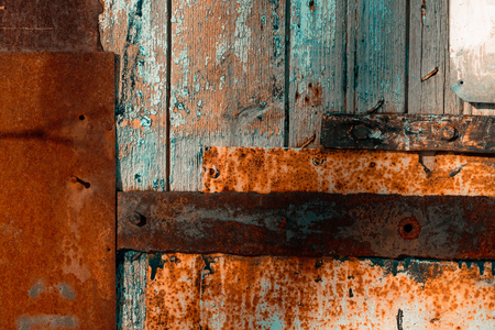 Colored rusty stained metal wall texture pattern. Close up photo.の写真素材