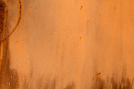 Colored rusty stained metal wall texture pattern. Close up photo.