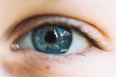 Beautiful blue single eye. Closeup photo.の写真素材