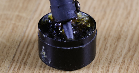 soldering iron in a jar with rosin