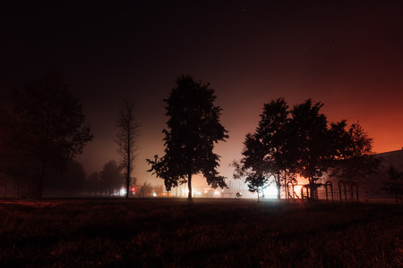 children's playground in the autumn foggy nightの写真素材