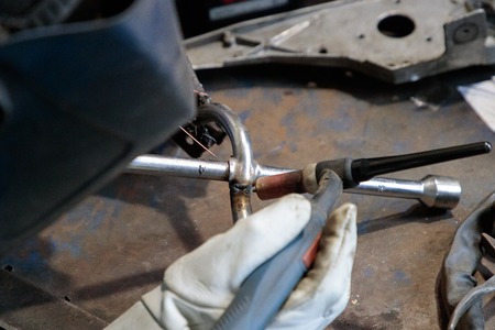 hands of the welder solder and connect the partsの写真素材