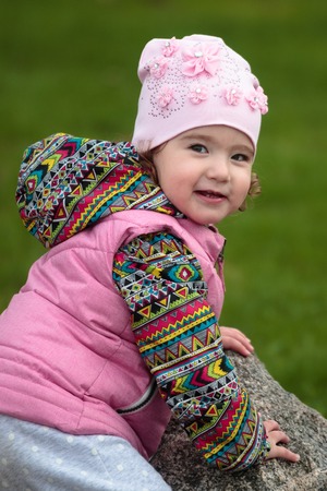 cute and little positive child on the streetの写真素材