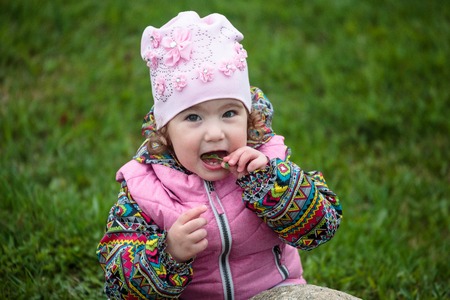 cute and little positive child on the streetの写真素材
