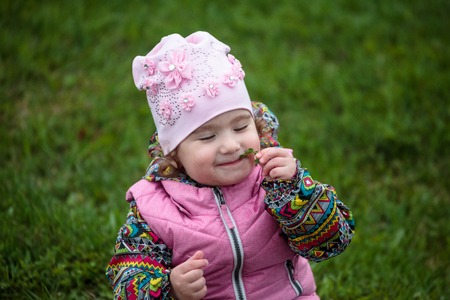 cute and little positive child on the street