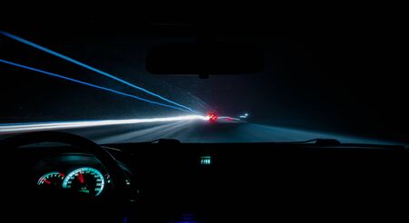 car drives a photograph on the road with a delay inside viewの写真素材