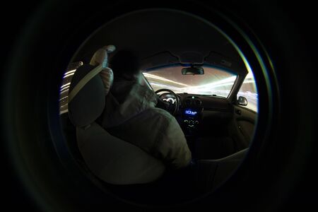 driver in the car inside view through the lensの写真素材