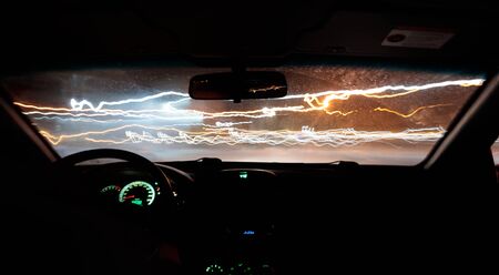 car drives a photograph on the road with a delay inside viewの写真素材