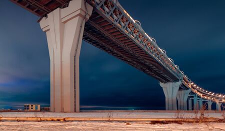 Western high speed diameter on Kanonersky Island in Saint Petersburg in the winter in the eveningの写真素材