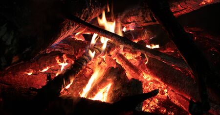 bright flaming of fire and hot wood at night
