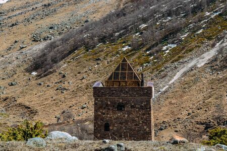 residential stone building in the mountains and daylight saving time in the daytimeの写真素材