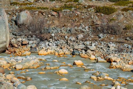 current of the river on mountain rocks in the daytimeの写真素材