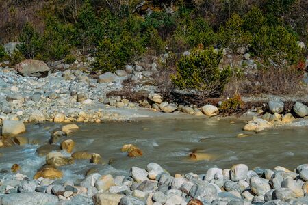 current of the river on mountain rocks in the daytimeの写真素材