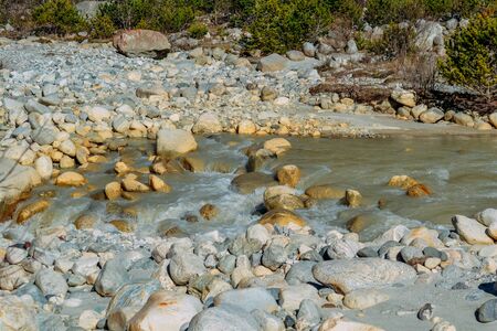 current of the river on mountain rocks in the daytimeの写真素材