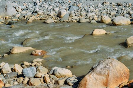 current of the river on mountain rocks in the daytimeの写真素材