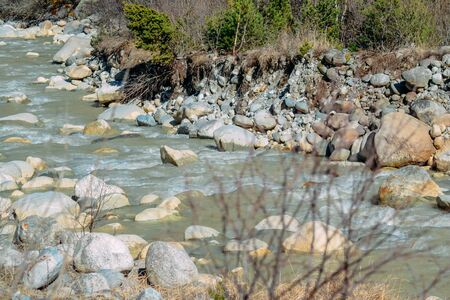 current of the river on mountain rocks in the daytimeの写真素材