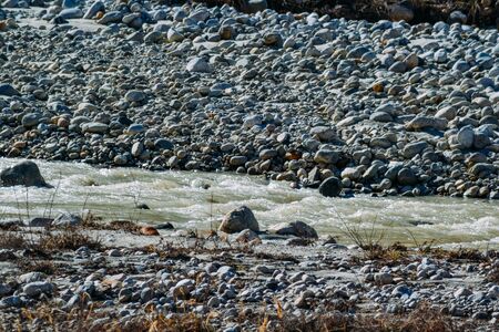 stones and snow in the highlands in the daytime