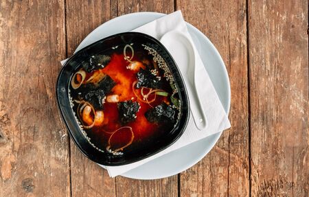 japanese miso soup with shrimps on an old wooden tableの写真素材