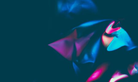 abstract dark background with broken colored patternsの写真素材