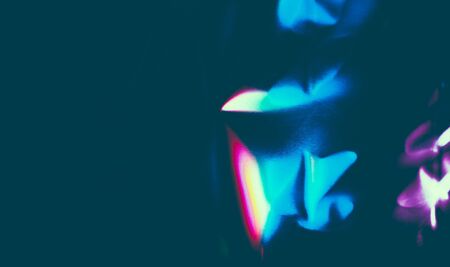 abstract dark background with broken colored patternsの写真素材