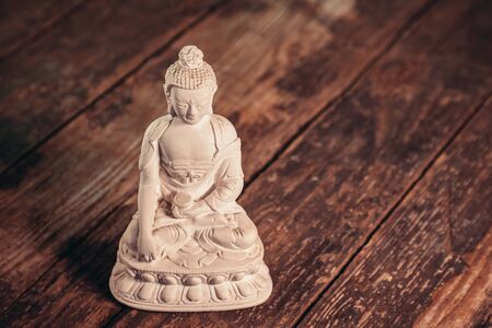 white figurine of the buddha of the fossilの写真素材