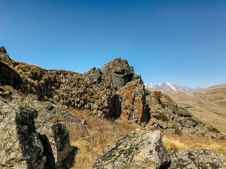 stone hills and mountains against the sky