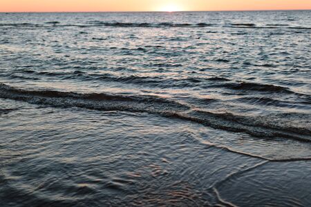 evening landscape of the sunset and the sea as well as the tide of water