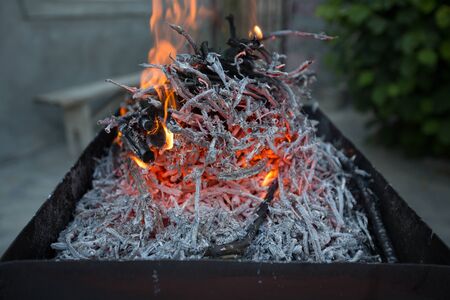 bonfire in the grill in the daytime in summerの写真素材