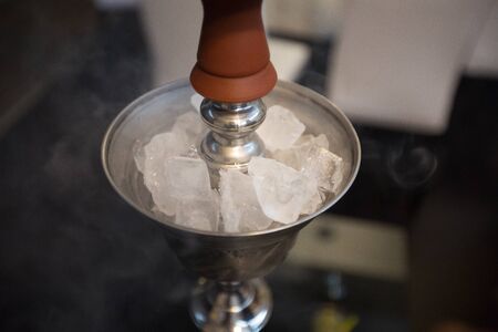 chunks of ice in ice cooler for shishaの写真素材