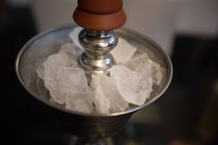 chunks of ice in ice cooler for shishaの写真素材