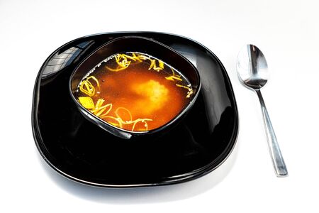 Japanese miso soup in a black plateの写真素材