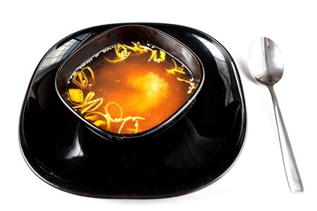Japanese miso soup in a black plateの写真素材