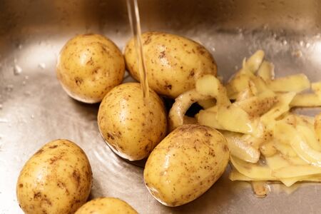 potatoes in the sinkの写真素材