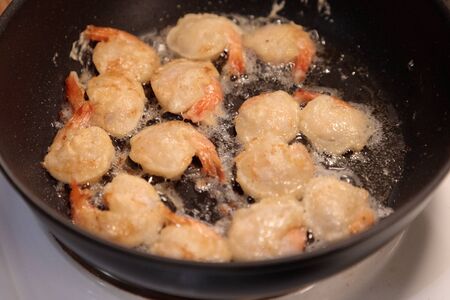 shrimp fried in a frying pan close-upの写真素材