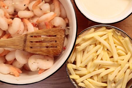shrimp french fries and sauce in the kitchen closeupの写真素材