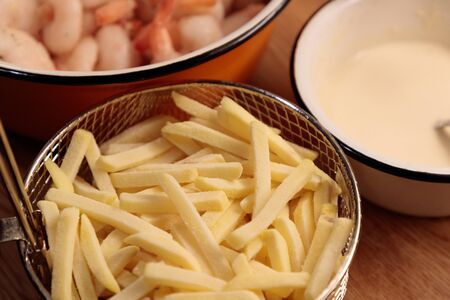 shrimp french fries and sauce in the kitchen closeupの写真素材