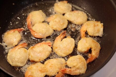 shrimp fried in a frying pan close-upの写真素材