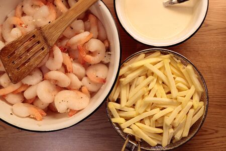 shrimp french fries and sauce in the kitchen closeupの写真素材