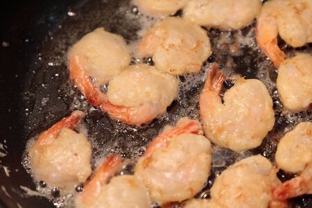 shrimp fried in a frying pan close-upの写真素材