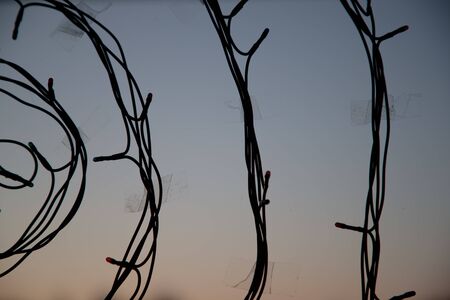 Decoration garland silhouette on the window close-up. Abstract backgroundの写真素材