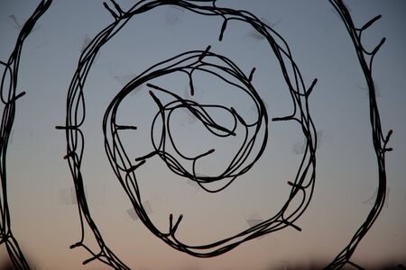 Decoration garland spiral silhouette on the window. Abstract backgroundの写真素材