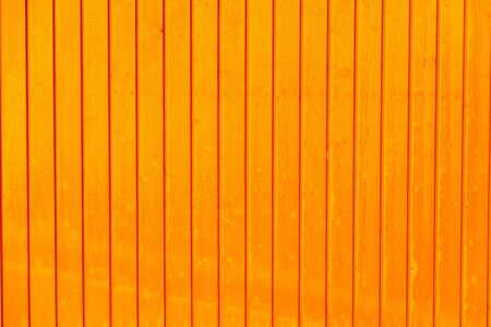 bright yellow vertical wooden boards backgroundの写真素材