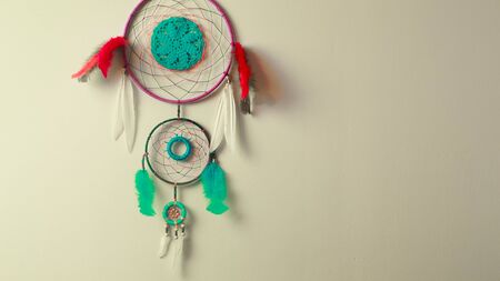 Dream Catcher shamanic amulet on the wall lightの写真素材