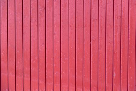 red wall of wooden boardsの写真素材