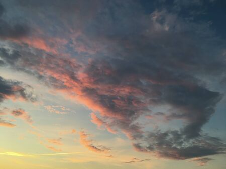 unusually beautiful sky with clouds at sunsetの写真素材
