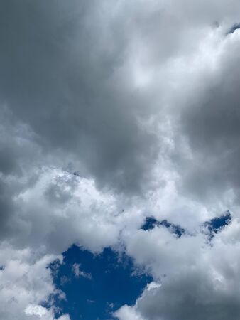 bright blue sky with white clouds at daytimeの写真素材