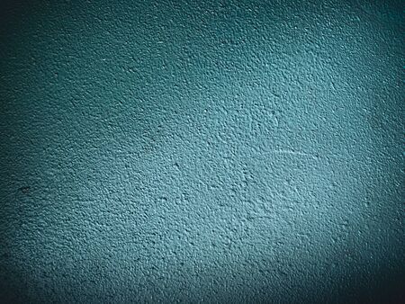 old rough dark blue-green wall backgroundの写真素材