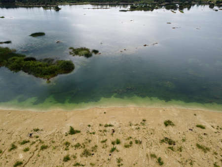 Old flooded sand pit aerial photoの写真素材